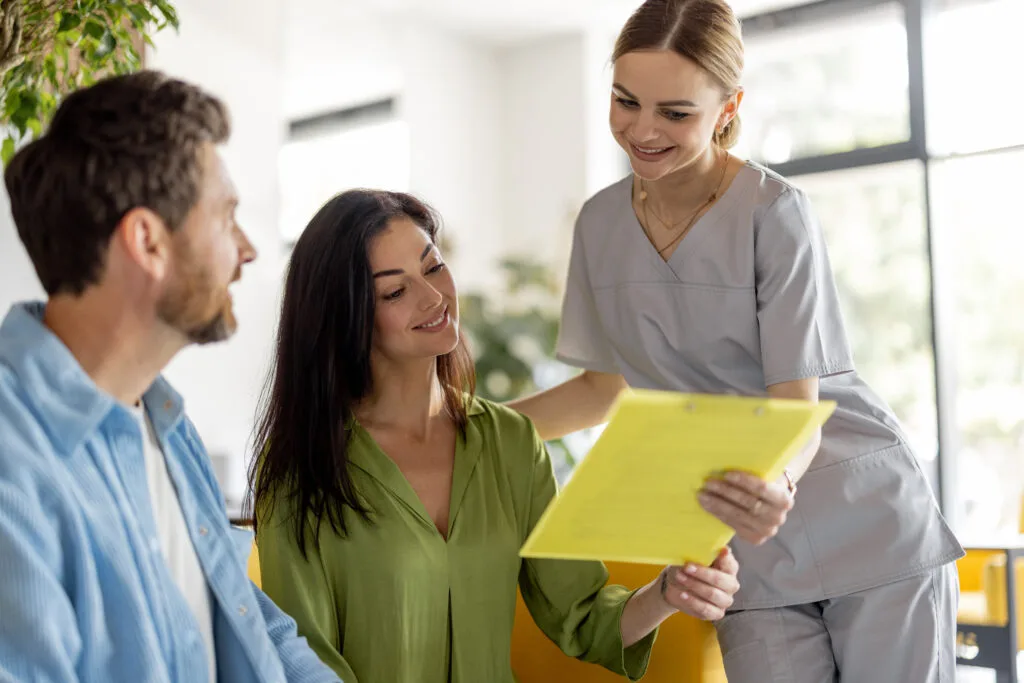 Nurse communicates with patients in waiting room