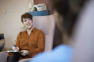 Woman filling out a questionnaire in a medical set