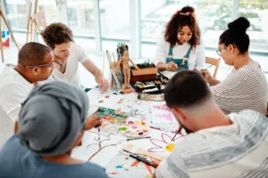group of people doing art in a circle