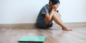 woman sad about what she saw on the scale
