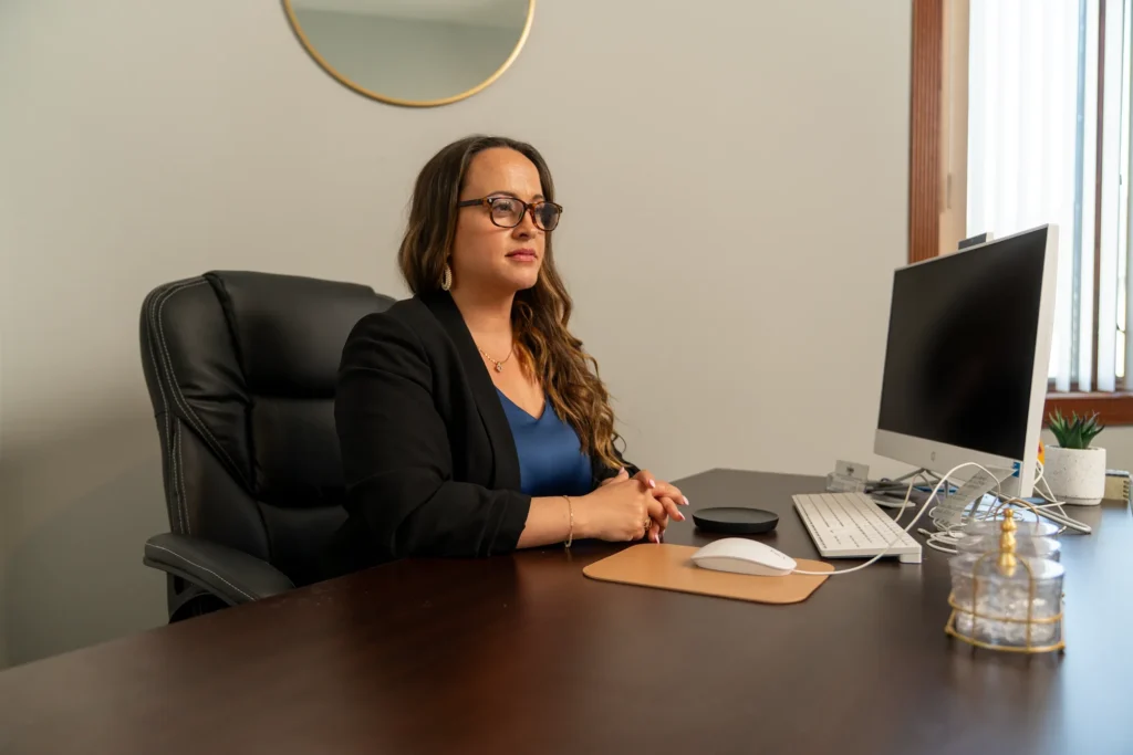Intake specialist at desk at We Care Health and Wellness